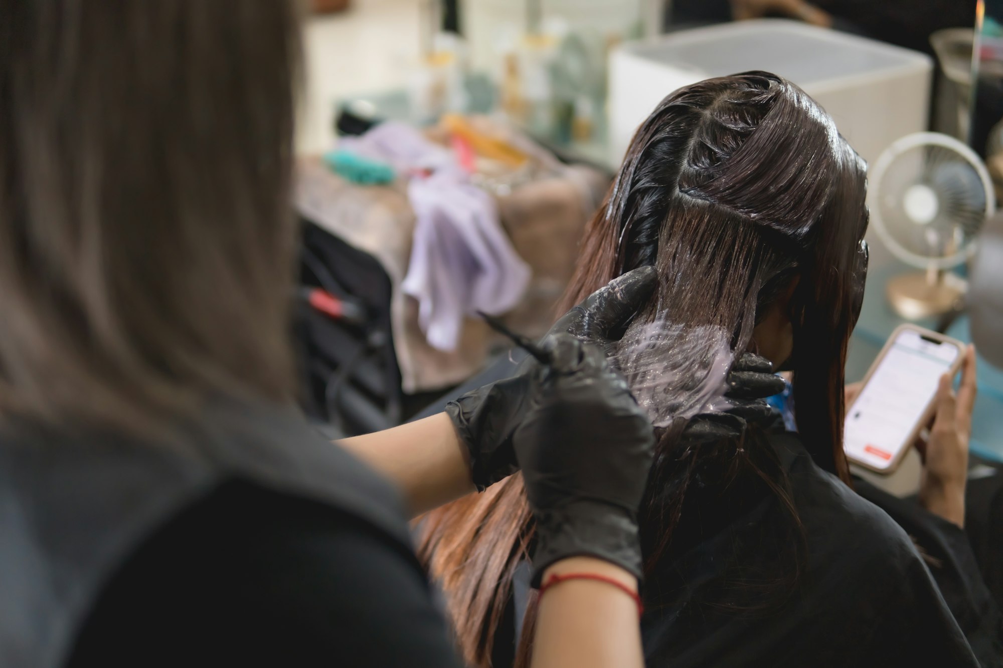 Hair coloring in a beauty salon, Asian women hair coloring in beauty salon.